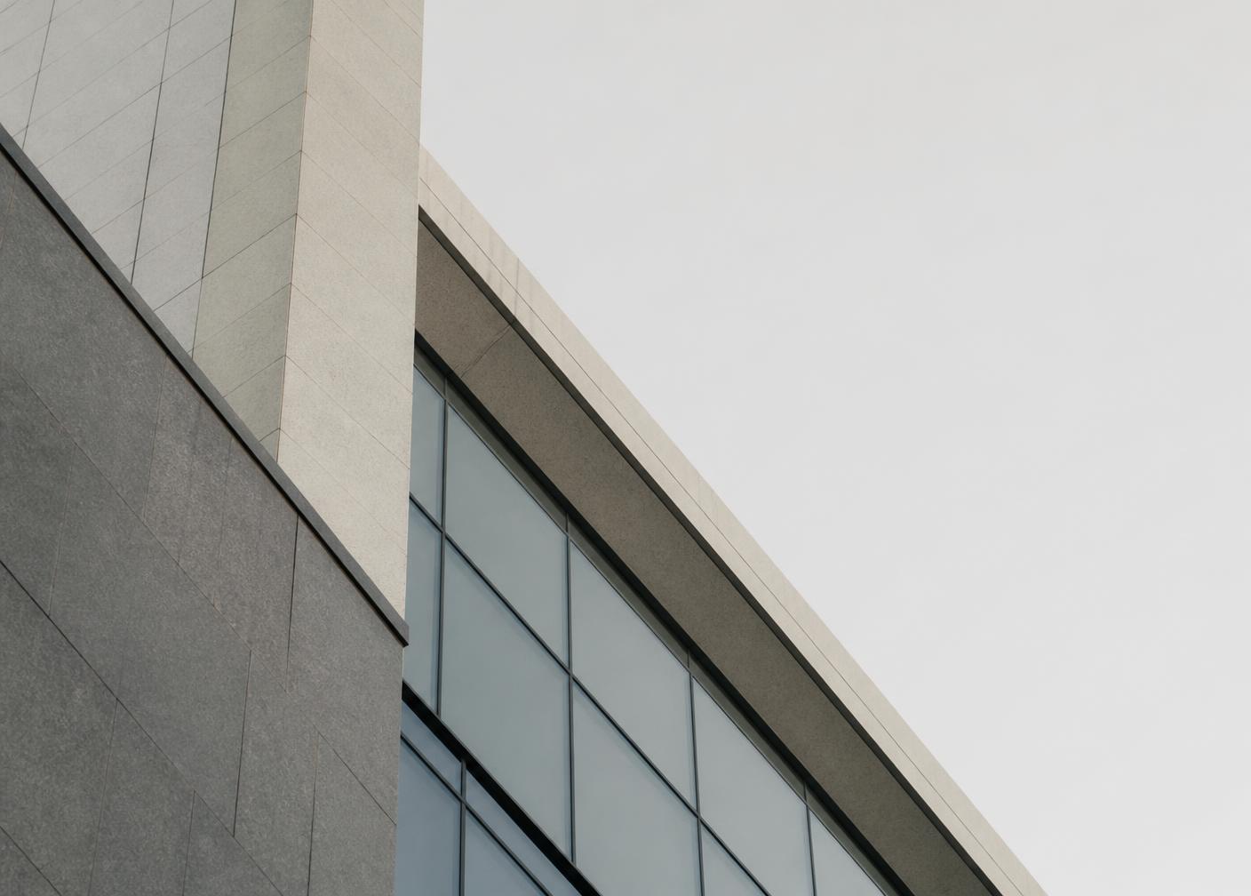 Angular stone and glass edge of a modern financial-district building